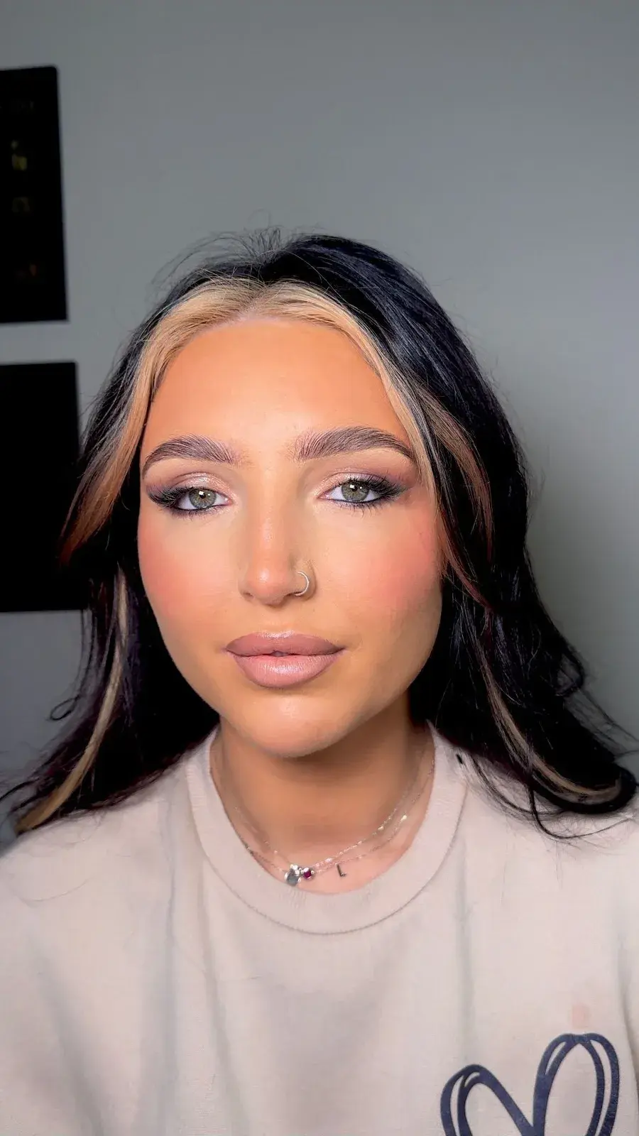 Glam makeup look on a client with curly hair