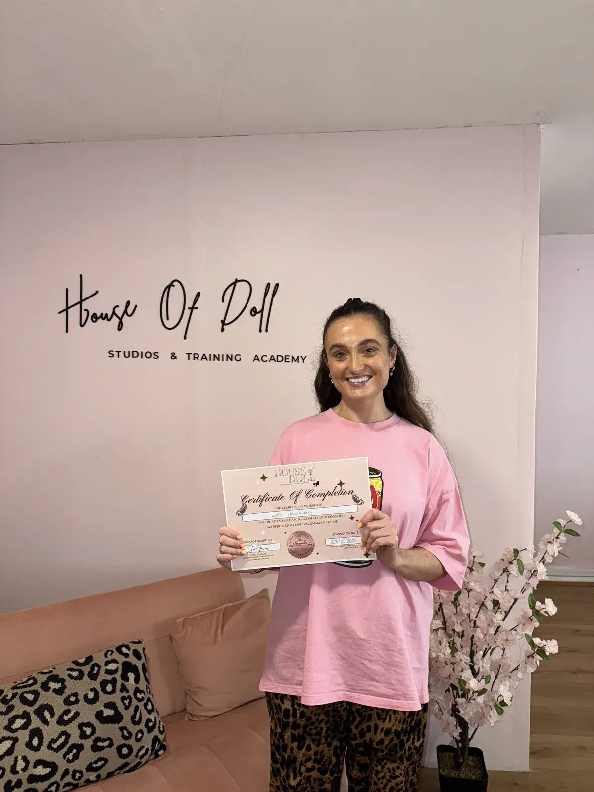 Student with her 2-day makeup course certificate