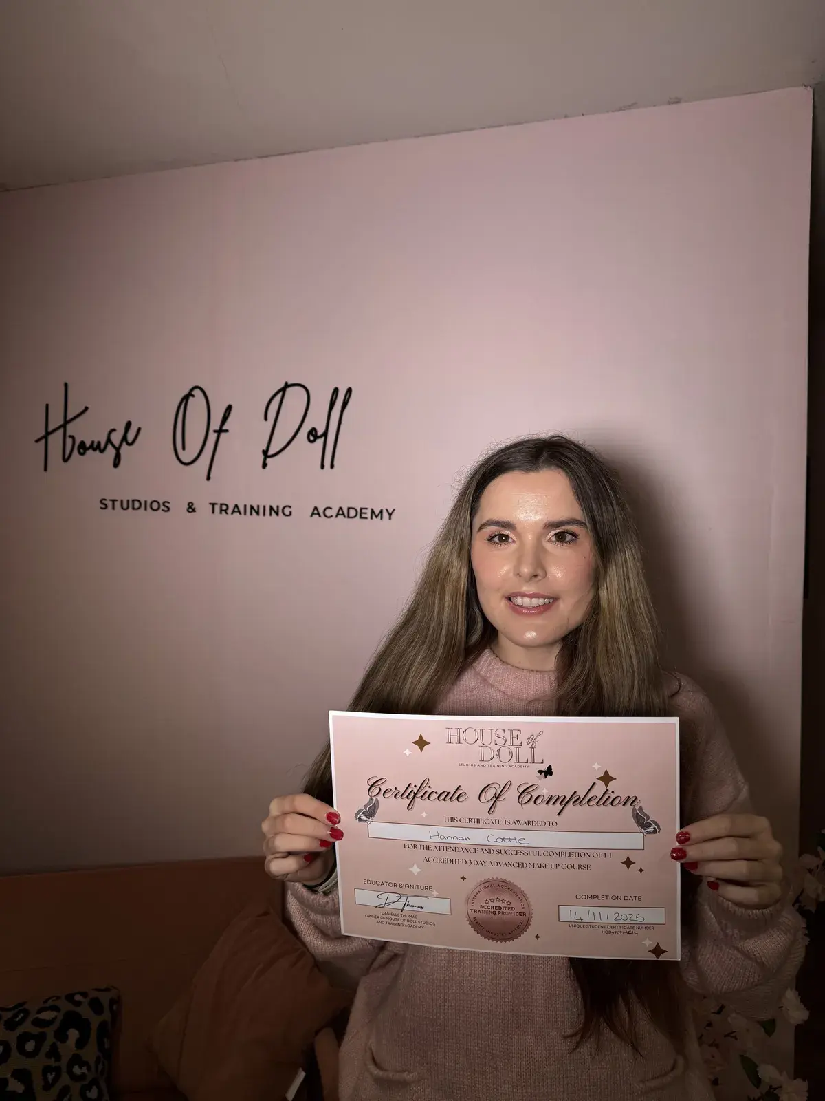 Student with her 3-day makeup course certificate